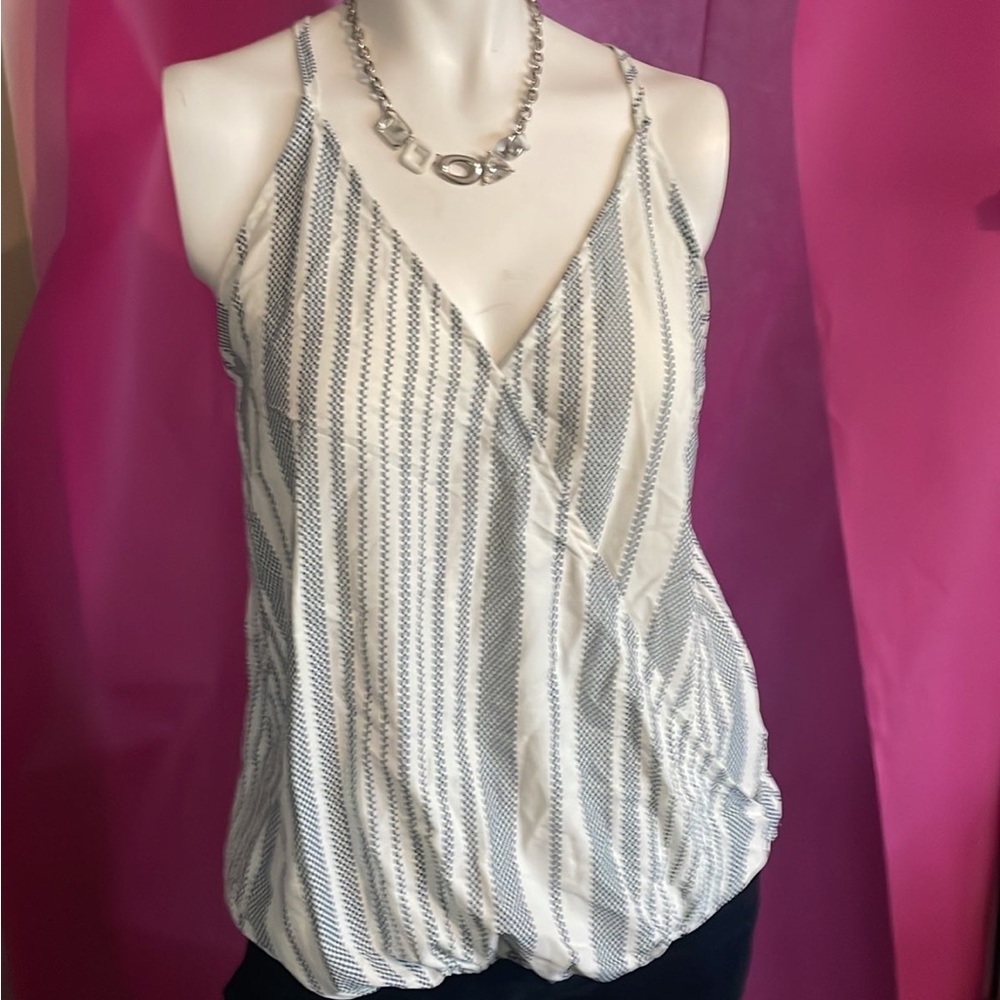 This is a no name brand racer back tank top in blue and white in size M
